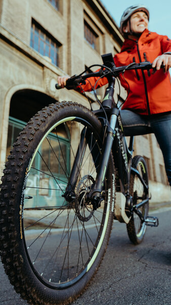 Close-up of bicycle with person on it